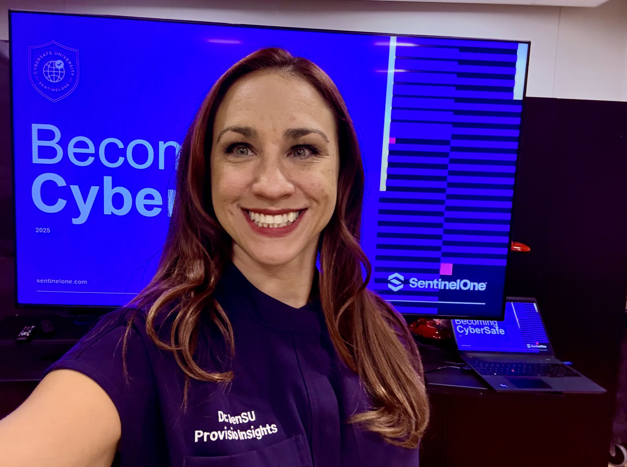 Dr. JenSU at CyberSafe Academy with a CyberSafe training screen
